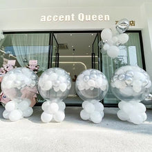 Load image into Gallery viewer, Remote control balloon popper creating dramatic balloon drop effect at wedding dance stage celebration
